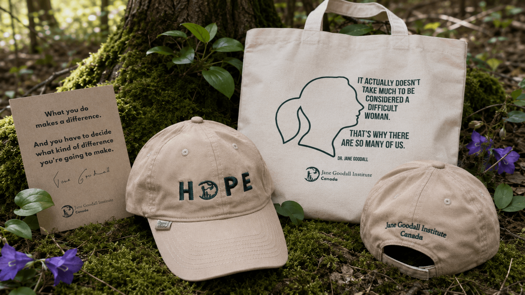 Jane Goodall Institute of Canada branded merch: a HOPE cap, canvas tote bag, and quote card displayed on a forest floor