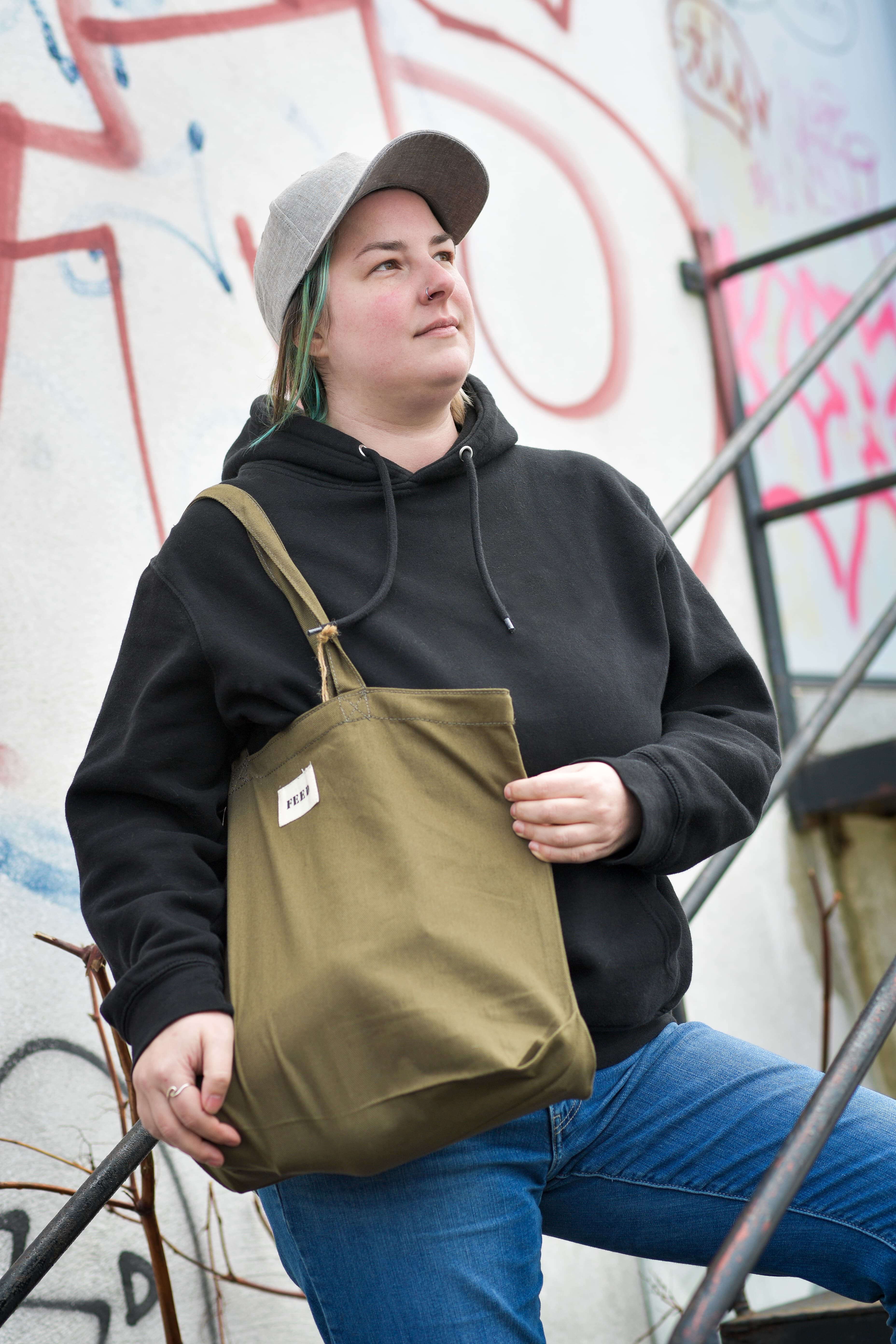 Team member carrying branded merchandise, representing spend tracked by department