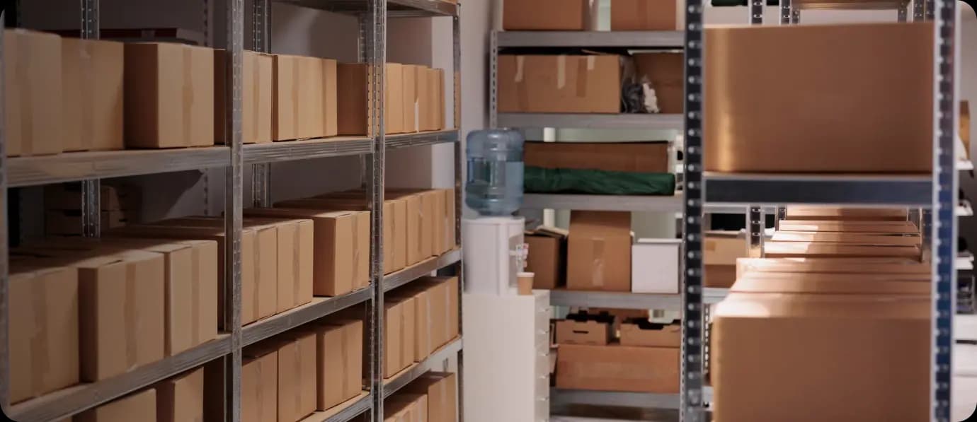 Warehouse interior with shelving units and promotional product inventory
