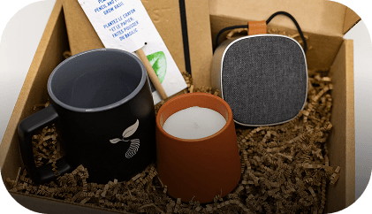 A person writing notes on a notepad, symbolizing planning or strategy for employee and client gifting.