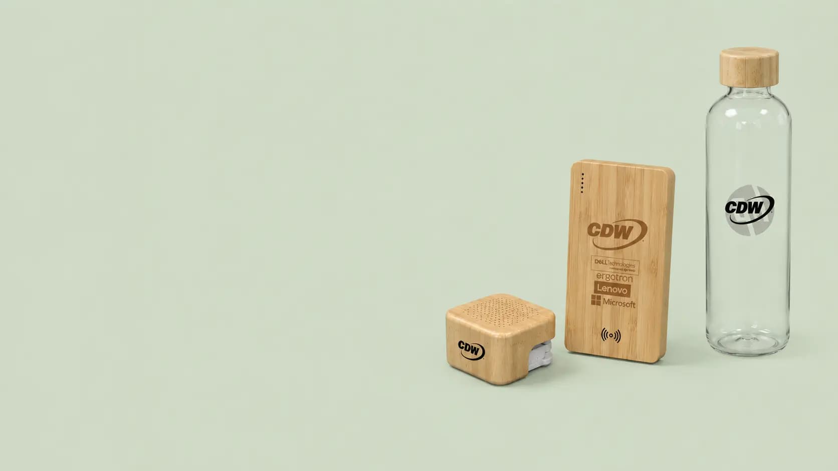 Bamboo Bluetooth speaker, wireless power bank, and glass water bottle branded with CDW and partner logos including Dell Technologies, Lenovo, and Microsoft